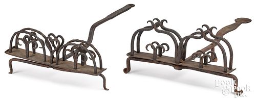 Two wrought iron toasters, 19th c.