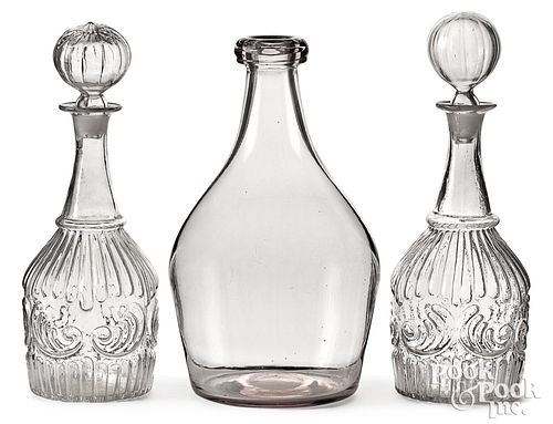 Pair of mold blown glass decanters, and a bottle