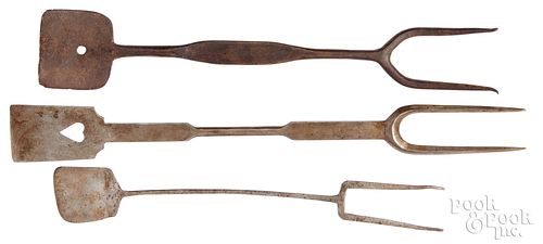 Three wrought iron combination fork and spatulas