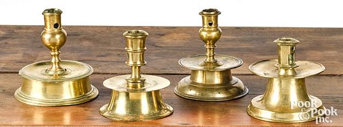 Four brass capstan candlesticks, 16th/17th c.