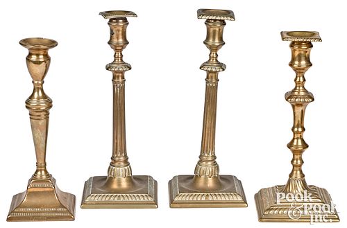 Four brass and bell candlesticks