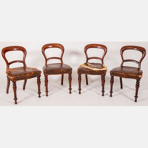 Four English Regency Mahogany and Leather Folding Campaign Chairs