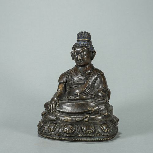 A copper Tibetan buddha statue