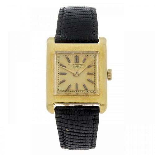 PATEK PHILIPPE - a wrist watch. Yellow metal case, stamped 0,750 with poincon. Numbered 614826. Sign