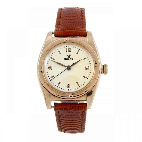 ROLEX - a gentleman's Bubble Back wrist watch. Circa 1947. Rose metal case, engine turned bezel, sta