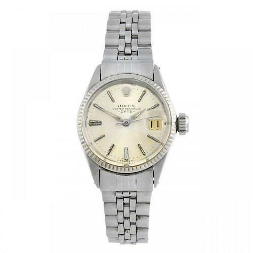 ROLEX - a lady's Oyster Perpetual Date bracelet watch. Stainless steel case with white metal fluted
