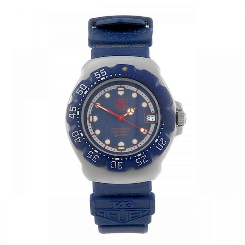 TAG HEUER - a mid-size Formula 1 wrist watch. Stainless steel case with plastic calibrated bezel. Nu