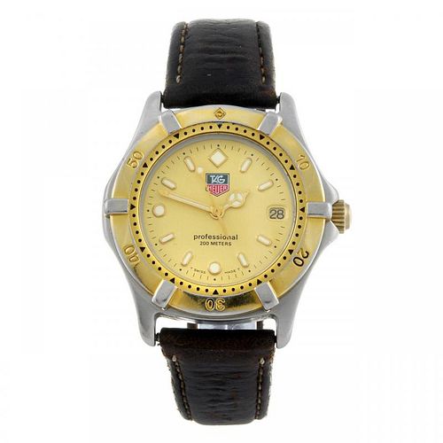 TAG HEUER - a mid-size 2000 Series wrist watch. Stainless steel case with gold plated calibrated bez