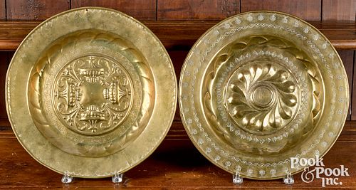 Two German embossed brass alms dishes, 17th/18th c