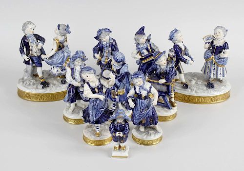 A large group of German porcelain figurines, circa 1900, comprising two pairs, one being dancers, th