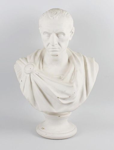 A large Victorian parianware bust of Julius Caesar, modelled in typical robes on spreading circular