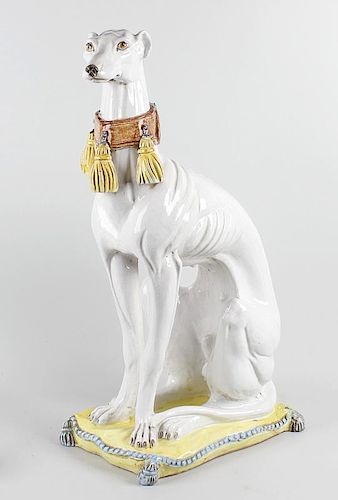 An imposing mid 20th century Italian majolica terracotta model of a greyhoundModelled in seated pose