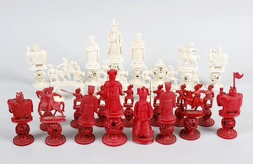 A 19th century Chinese Canton carved ivory chess set, of red stained and natural colour, each of thr