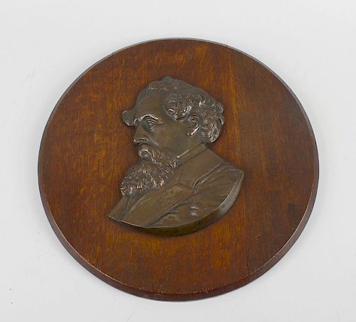 A cast bronze wooden mounted wall plaque, having profile portrait of a bearded male, possibly Charle