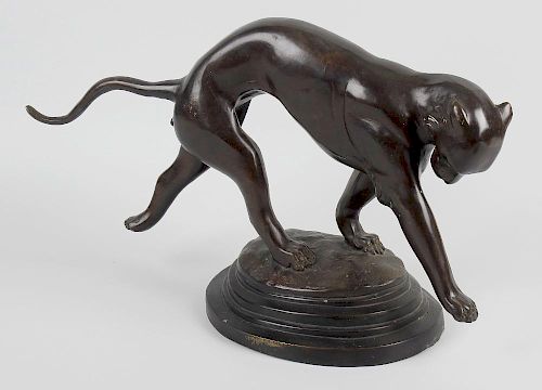 A bronze figure of a panther, modelled in running pose, upon stepped oval base, 10.25 x 17 (26cm x 4