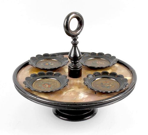 A lacquer and papier mache Lazy Susan, the ring handle and knopped stem leading to the circular tray