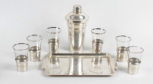 A French Art Deco silver plated cocktail set, comprising shaker of plain and part reeded form, six s