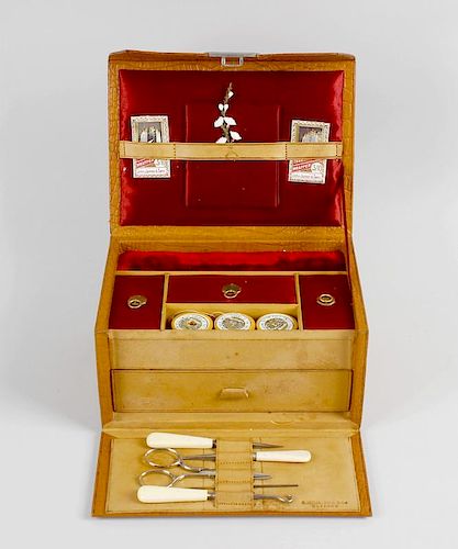 A faux-crocodile cased sewing compendium, retailed by R. Wylie Hill & Co., Glasgow, having pierced s