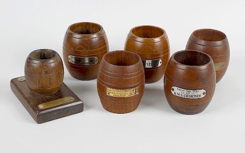 Shipbreakers timber. Six barrel shaped turned wooden containers each with applied metal plaque of na
