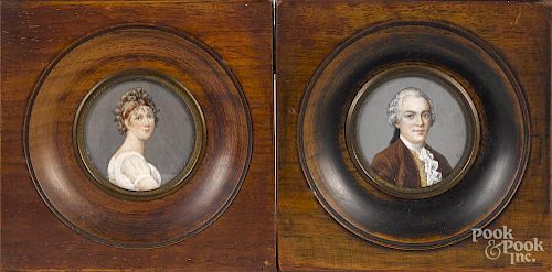 Pair of miniature watercolor portraits, early 20th c., of a man and woman, initialed FL