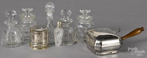 Two pieces of silver plate, together with five colorless glass bottles