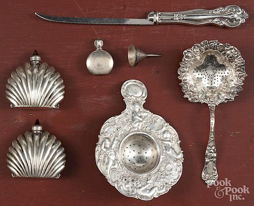 Silver of varying grades, to include two tea strainers, three scent bottles, a miniature funnel