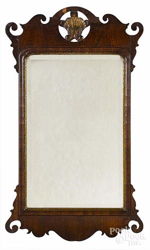 George II walnut veneer looking glass, mid 18th c., with a parcel gilt plume, 38 1/2'' h.