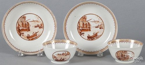 Pair of Chinese export cups and saucers, ca. 1800, with sepia harbor scenes.