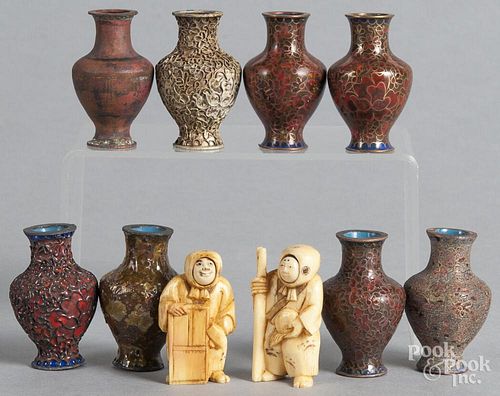 Chinese cased set of bottles displaying the stages of cloisonné, together with two netsukes.