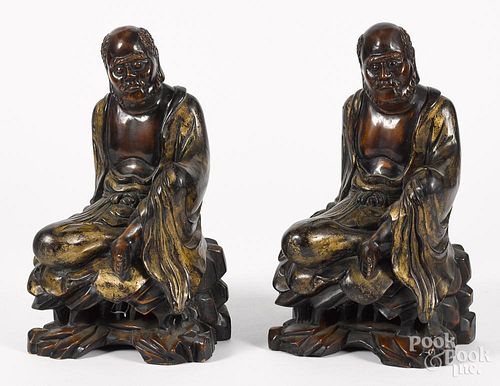 Pair of Chinese carved and gilt decorated Buddhas, early 20th c., 20'' h.