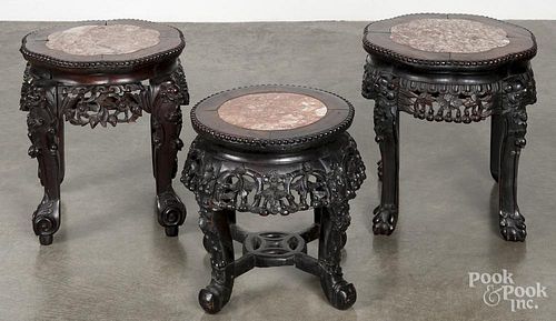Pair of Chinese carved hardwood marble top stands, 15'' h., together with a single stand, 13 1/4'' h.