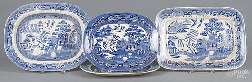 Blue Willow well and tree platter, 14 1/4'' l., 18'' w., together with three other platters.