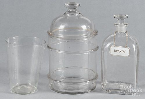 Colorless glass apothecary bottle, 19th c., 9 3/4'' h., together with a decanter and a flip.