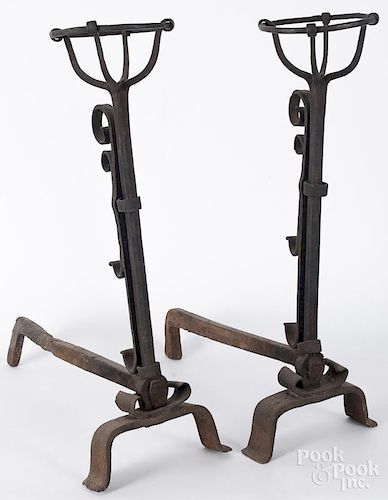 Pair of Continental wrought iron andirons, 18th c., 24'' h., 21'' l. Provenance: DeHoogh Gallery
