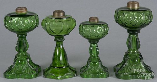 Four emerald glass fluid lamps, late 19th c., tallest - 10 1/2''.