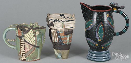 Three contemporary pottery pitchers, tallest - 11 1/2''.
