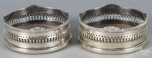 Pair of silver-plated wine coasters, early 20th c., 2 1/2'' x 5 1/2''.