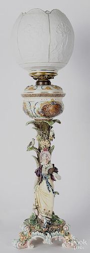 Austrian majolica style fluid lamp, late 19th c., with a figural woman holding a fan