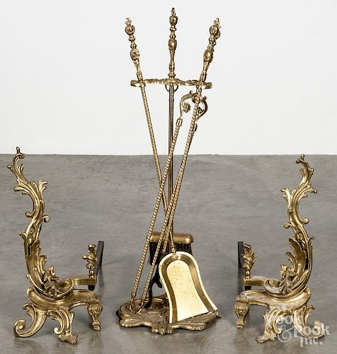 Pair of French bronze chenets, 18 1/2'' h., together with a set of fire tools and a wall plaque.