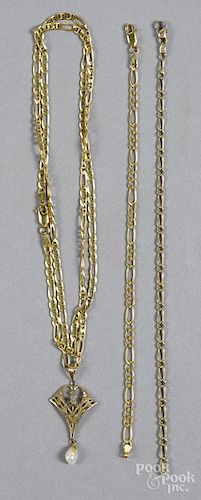 14K yellow gold chain link necklace, 23 1/2'' l., with a 10K yellow gold antique charm