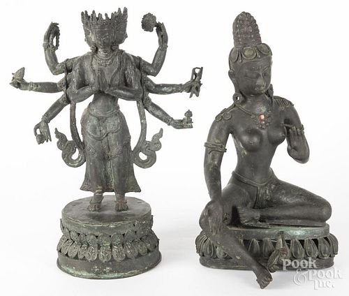 Two Southeast Asian bronze deities, 20th c., 16 1/4'' h. and 17'' h.