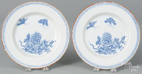 Pair of Delft blue and white plates, 18th c., with butterfly decoration, 8 3/4'' dia.