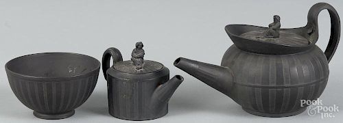 Two Wedgwood black basalt teapots, together with a tea bowl.