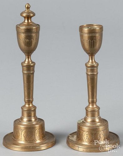 Pair of Turkish bell metal candlesticks, 19th c., 8 1/4'' h. and 9 1/2'' h.