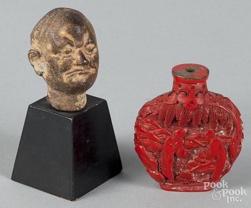 Chinese cinnabar snuff bottle, 2 1/4'' h., together with a bronze head, 2'' h.