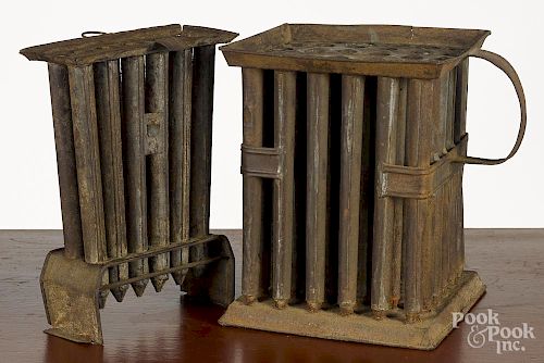 Two tin candlemolds, 19th c., 10'' h., 7 1/2'' w. and 10'' h., 8'' w.