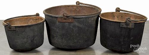 Three Pennsylvania copper apple butter kettles, 19th c., largest - 18'' h., 28'' w.