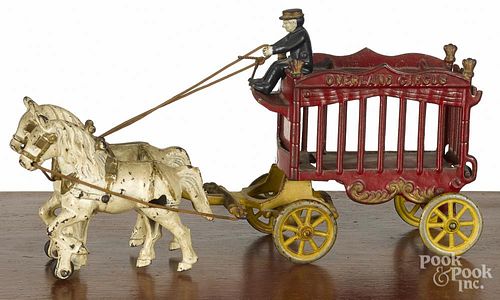 Cast iron horse drawn Overland Circus wagon, late 19th c., 14'' l.