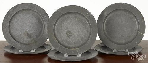 Six English pewter plates, early 19th c., with illegible touchmarks, 9 1/4'' dia.