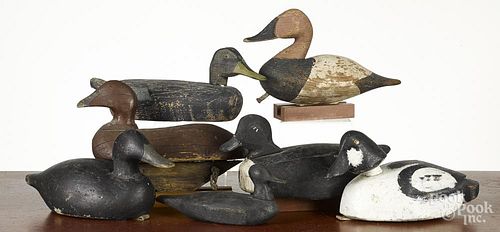 Duck decoys, 20th c., together with a pack basket.